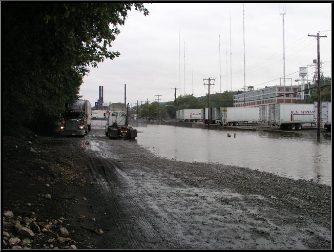 Truck negotiates flood water on Flat Rock Road