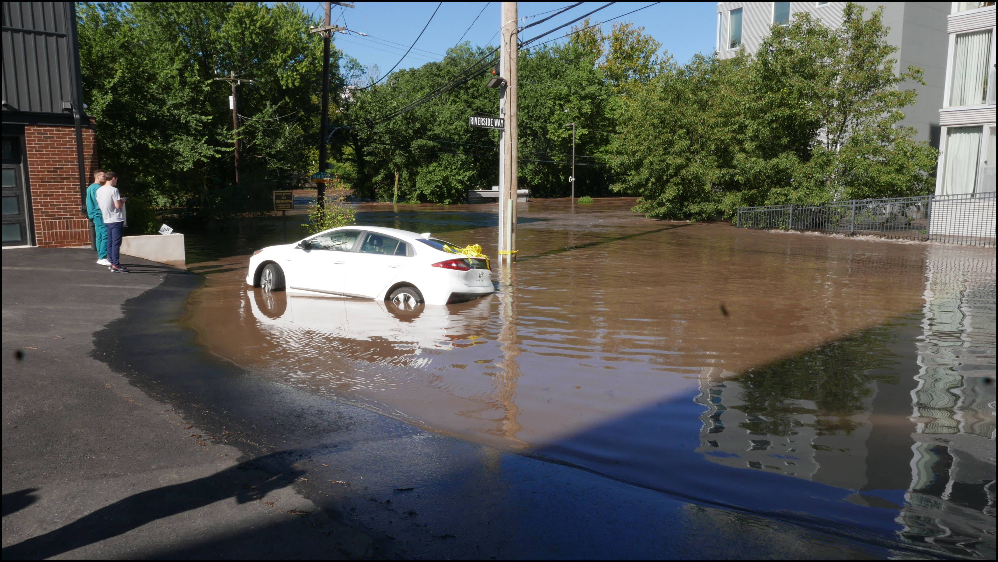 The Locks development -- Flooded car blocking the entrance.