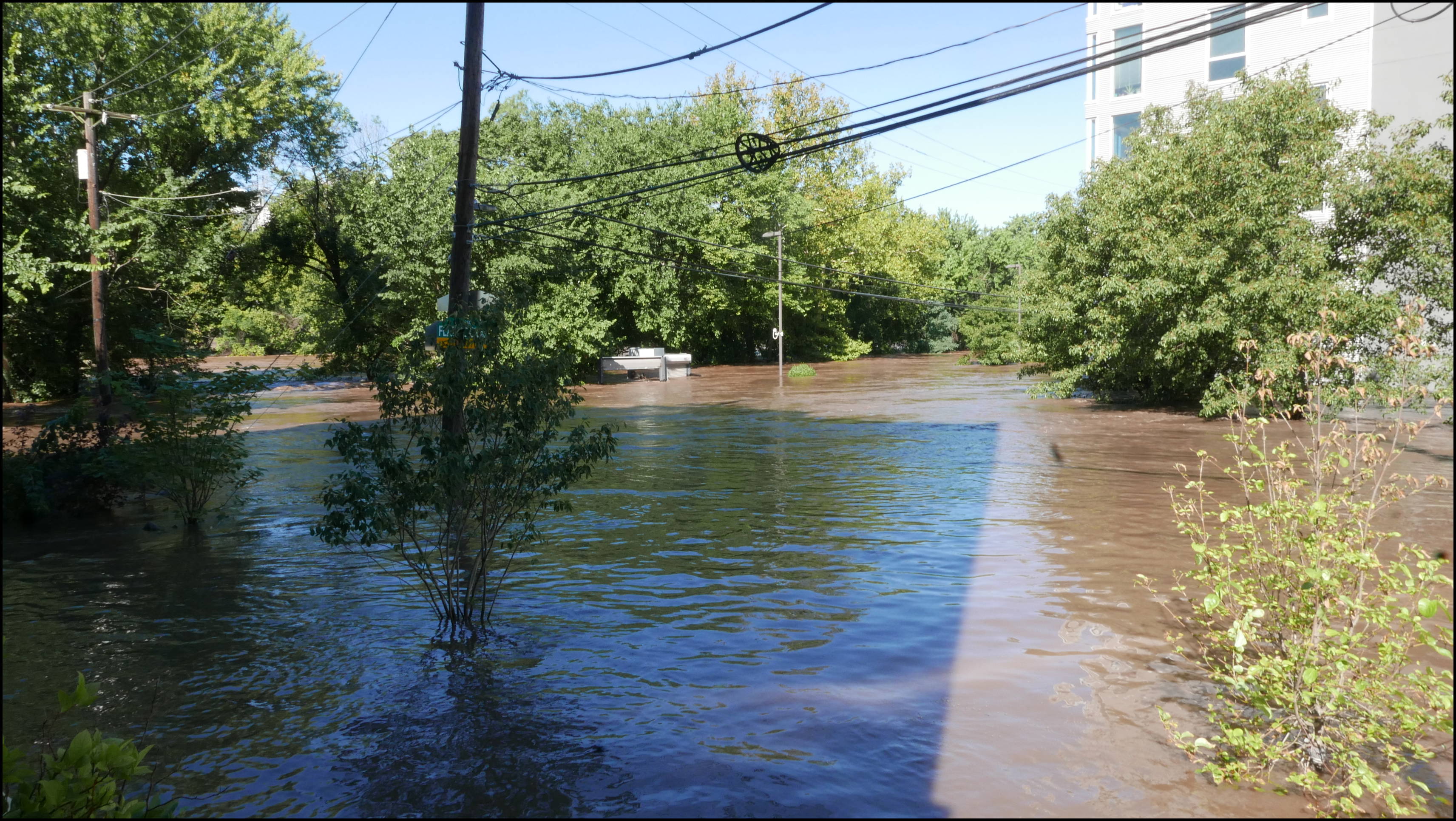 Leverington and Flat Rock Road -- There is a parking lot behind the building top sticking up. Hope they got all the cars out.