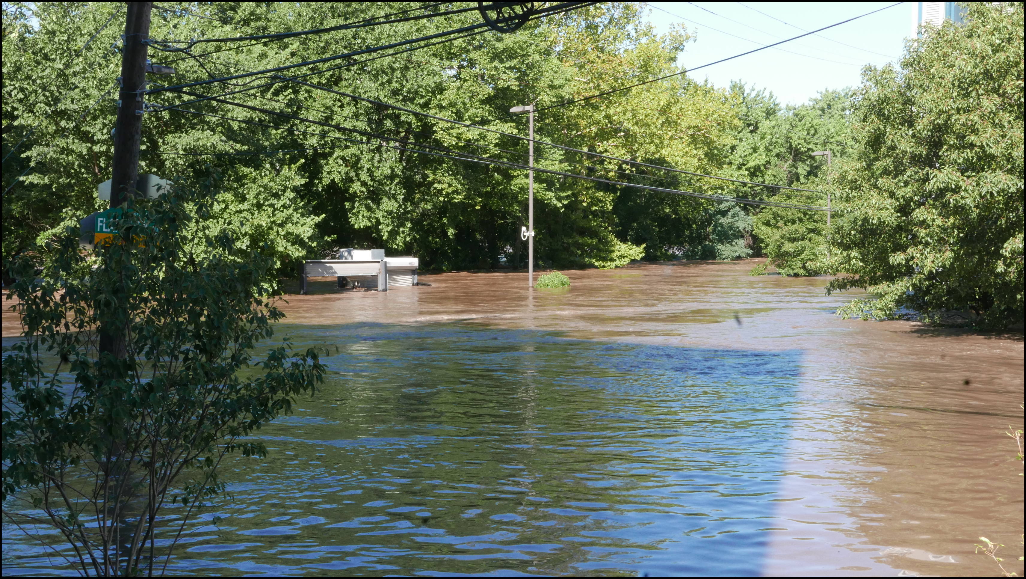 Leverington and Flat Rock Road -- There is a parking lot behind the building top sticking up. Hope they got all the cars out.