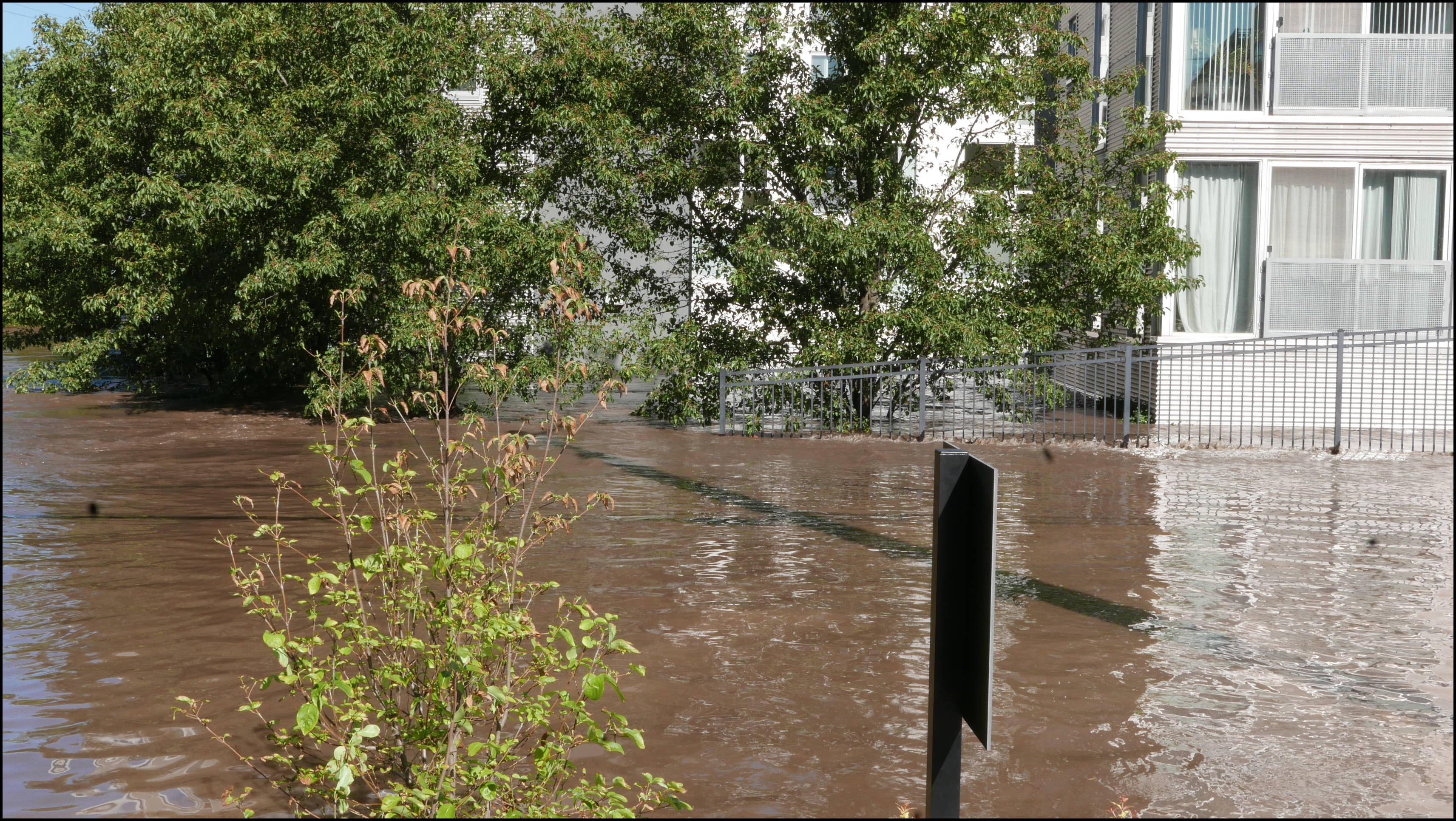 Leverington and Flat Rock Road -- Venice Lofts parking lot. Yes there is a parking lot under that building. Hope the got all the cars out.