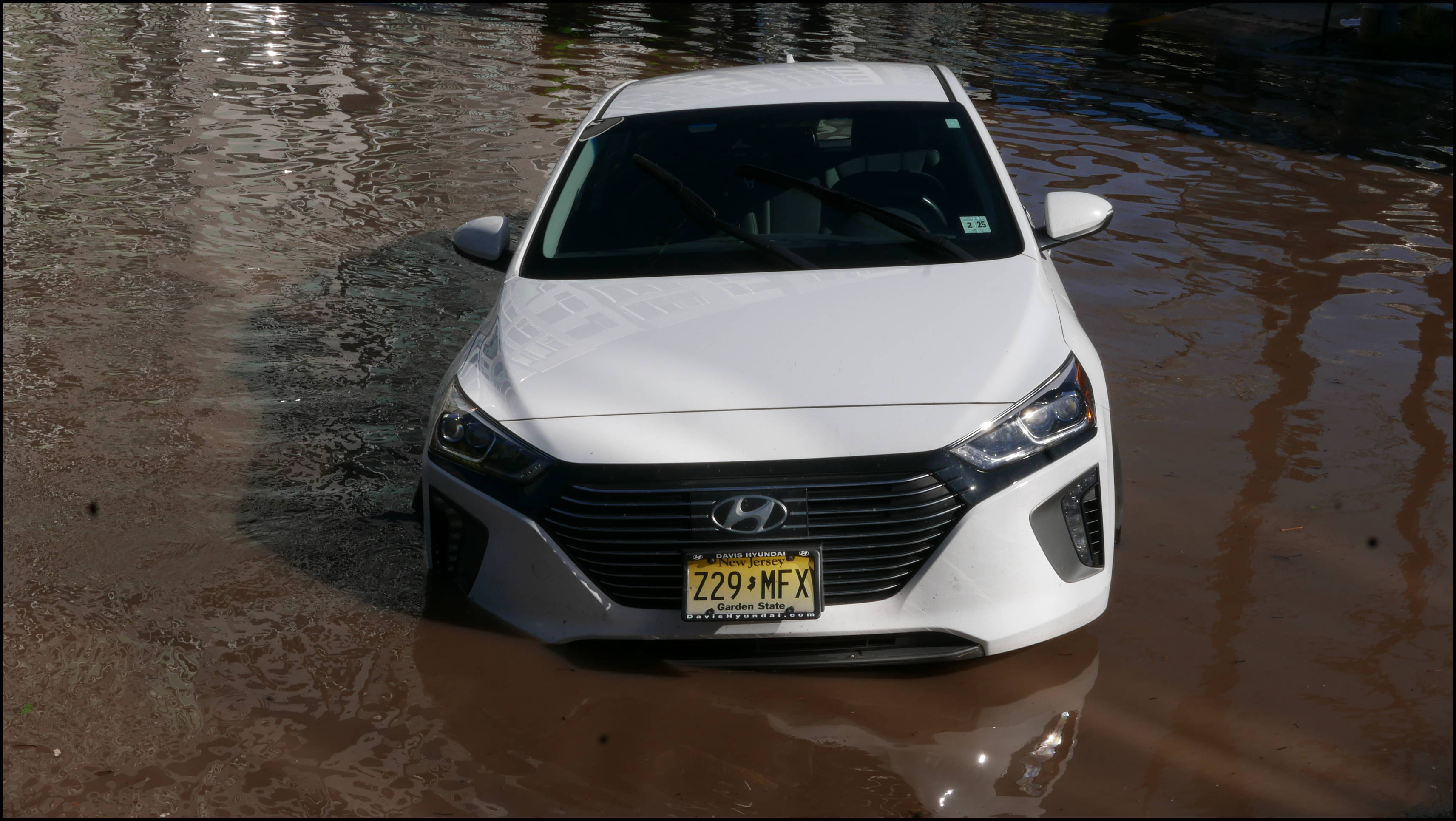 The Locks development -- Flooded car blocking the entrance.