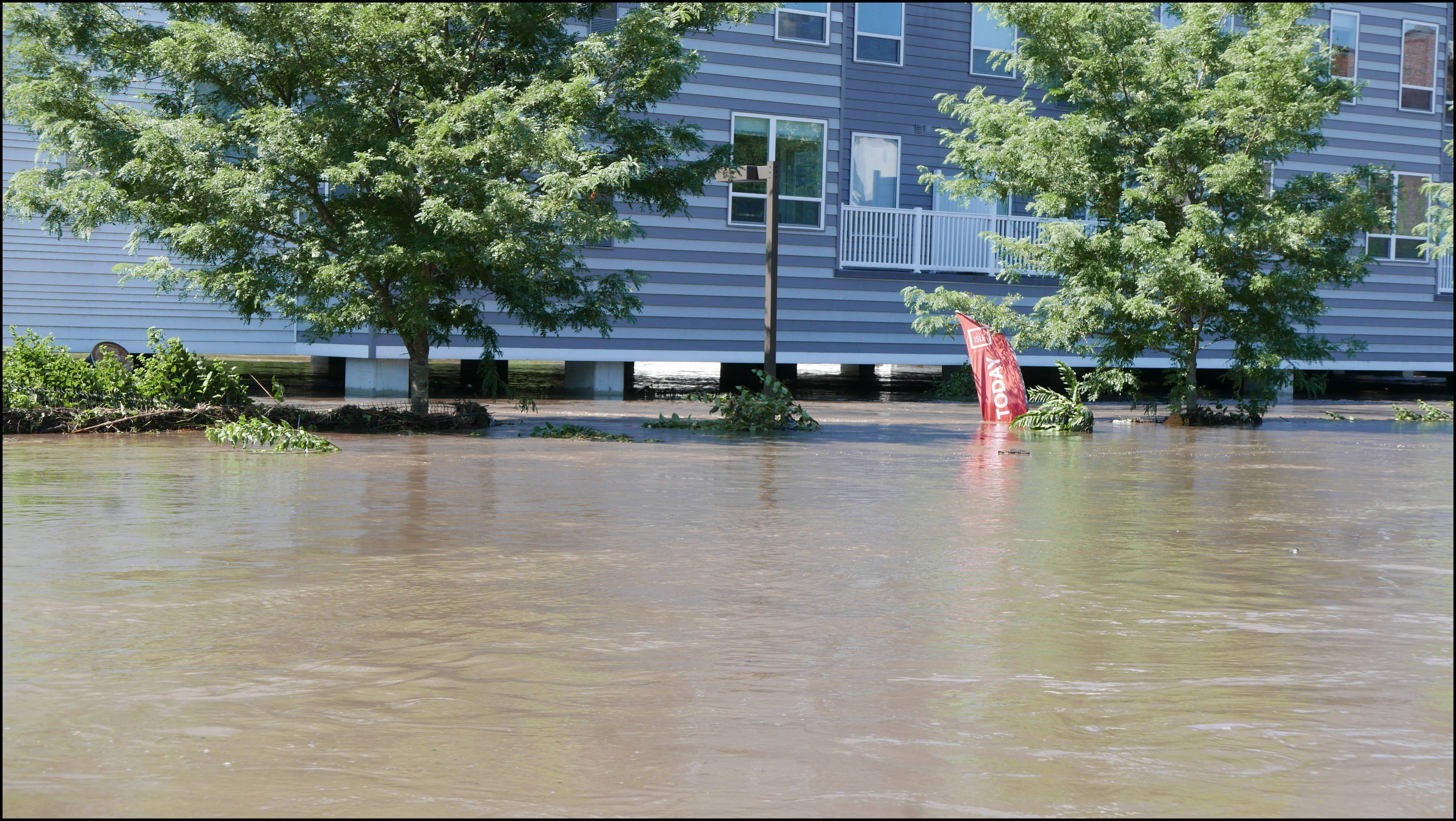 Cotton Street and the canal -- The Isle. A little bit of daylight under the building.