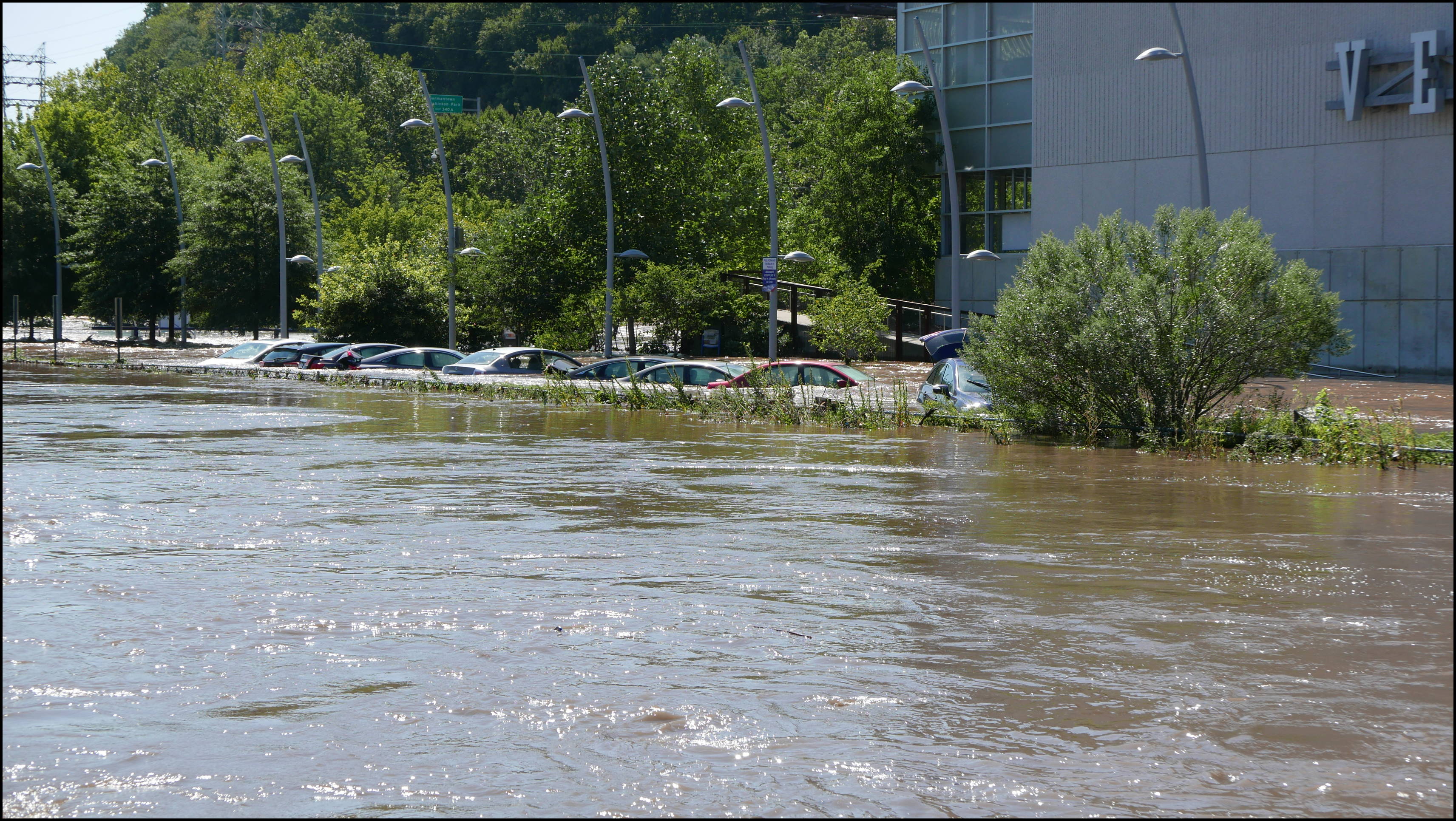 Cotton Street and the canal -- Flooded cars in the Rec Center parking lot