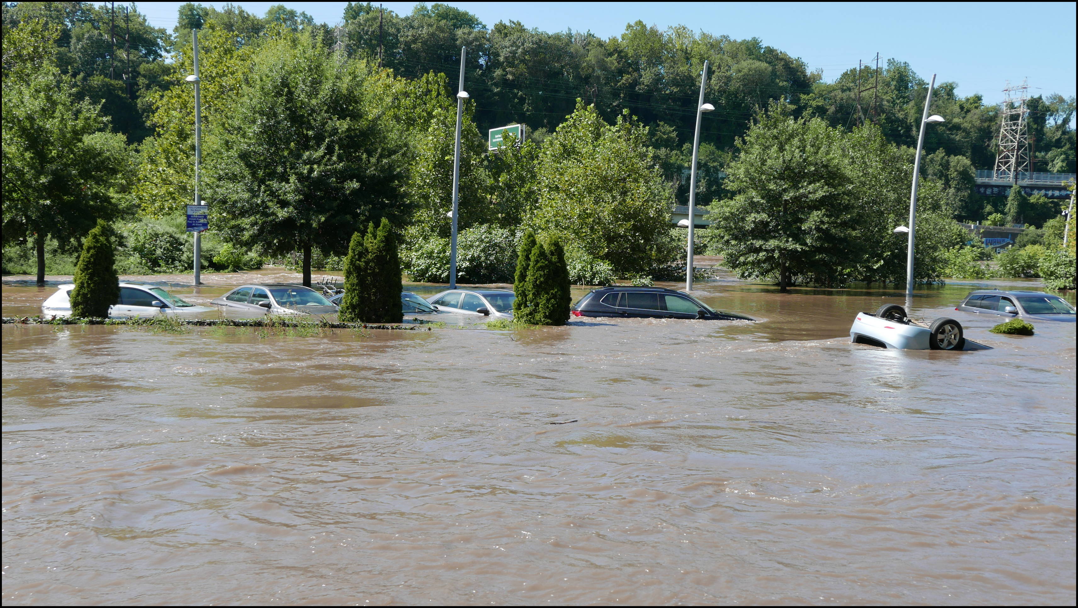 Cotton Street and the canal -- Flooded cars in the Rec Center parking lot