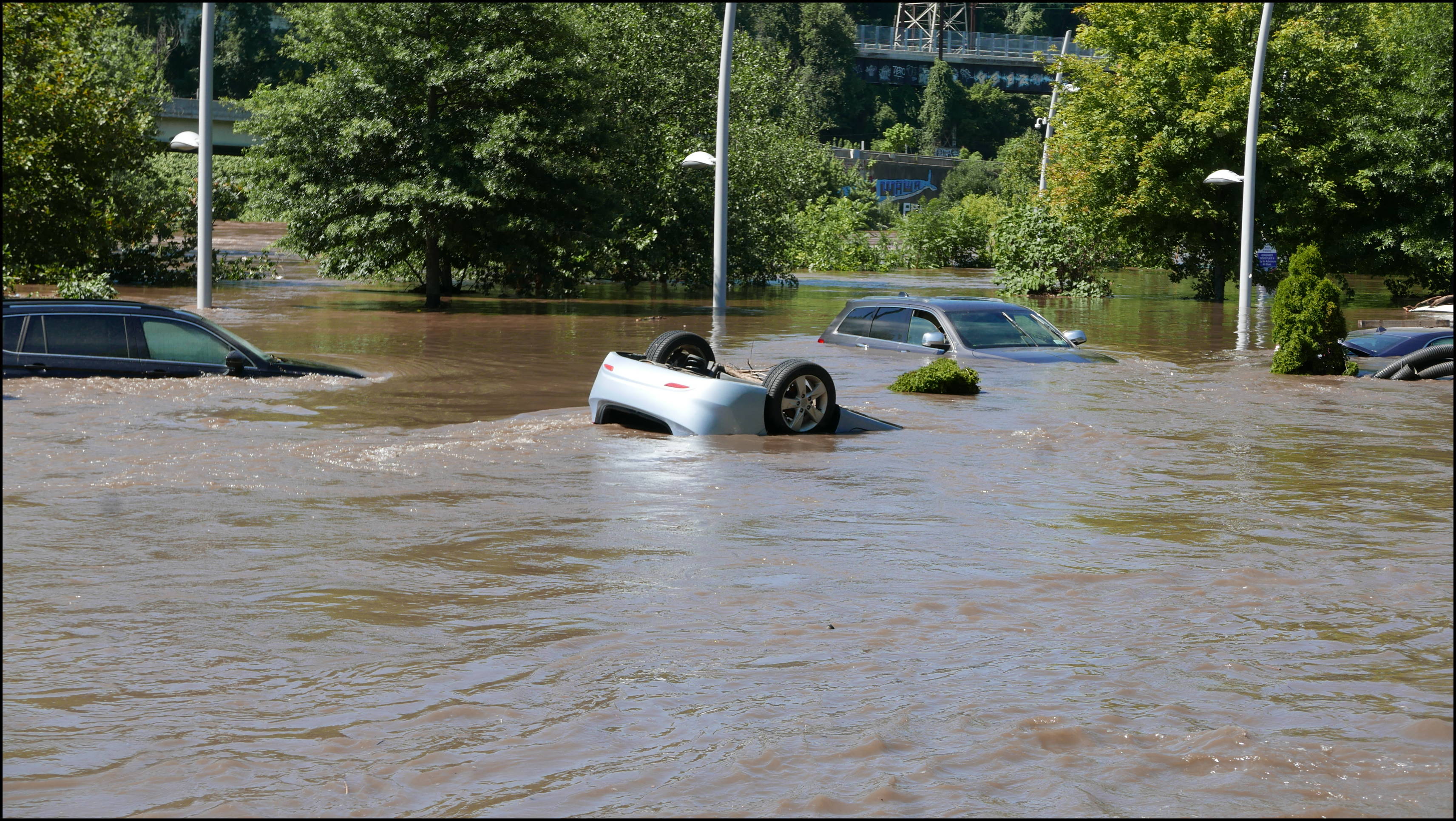 Cotton Street and the canal -- Flooded cars in the Rec Center parking lot