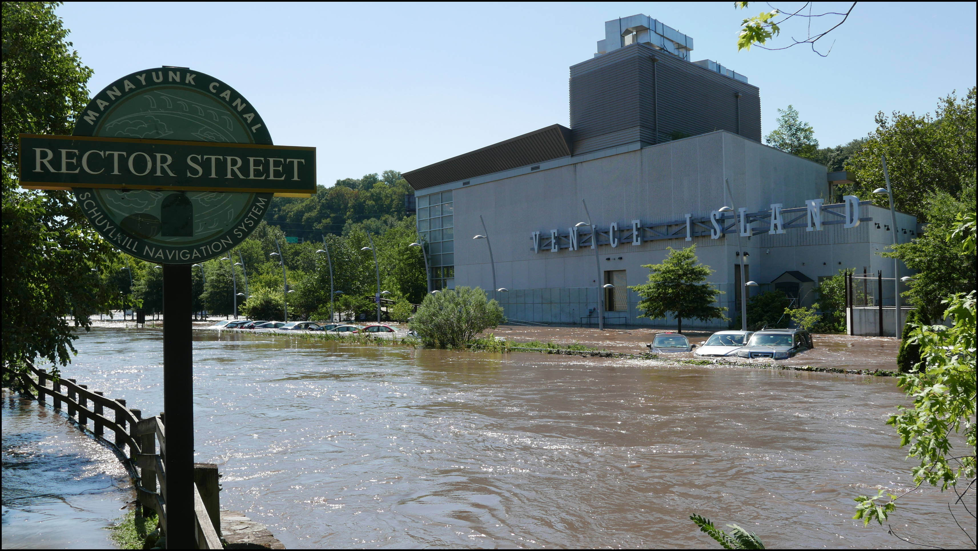 Rector Street and the canal -- VI Rec Center and flooded cars.