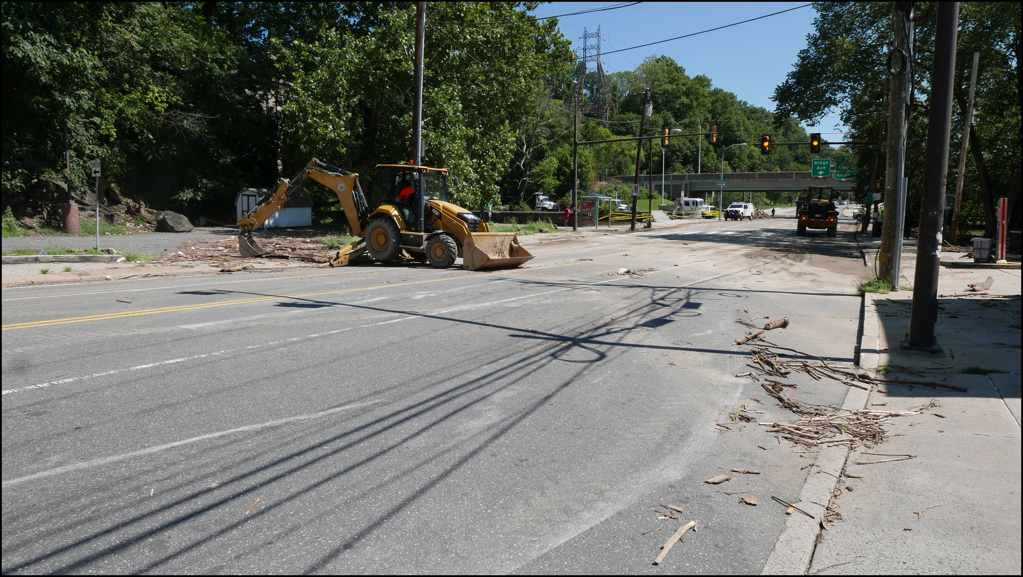 Wissahickon Creek and Ridge Ave (Wissahickon Transfer) -- Debris from Wissahickon Creek overflowing it's banks and over topping the bridge.