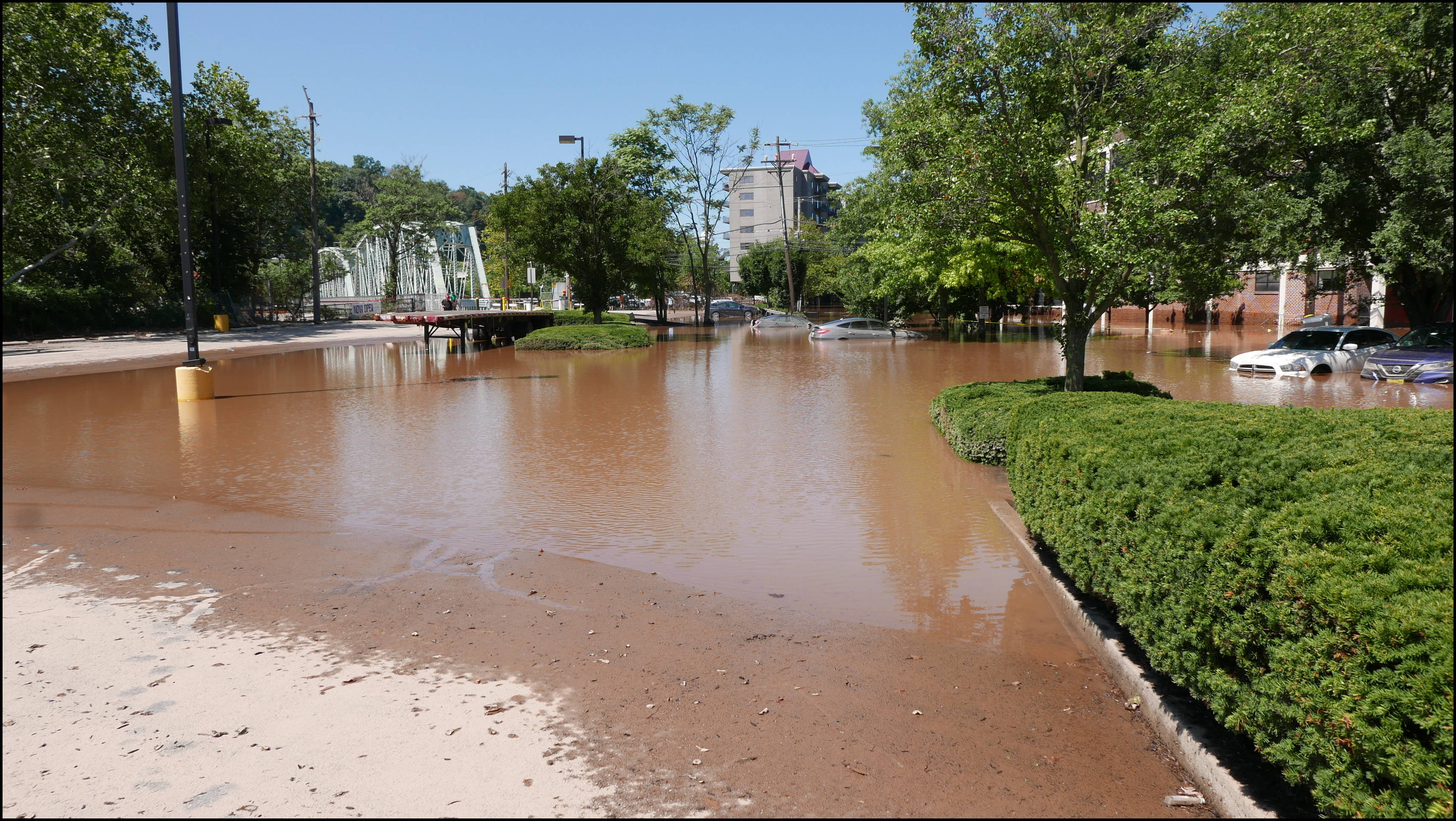 Southern limit of flooding on Main Street -- Flooded cars in the theater parking lot.