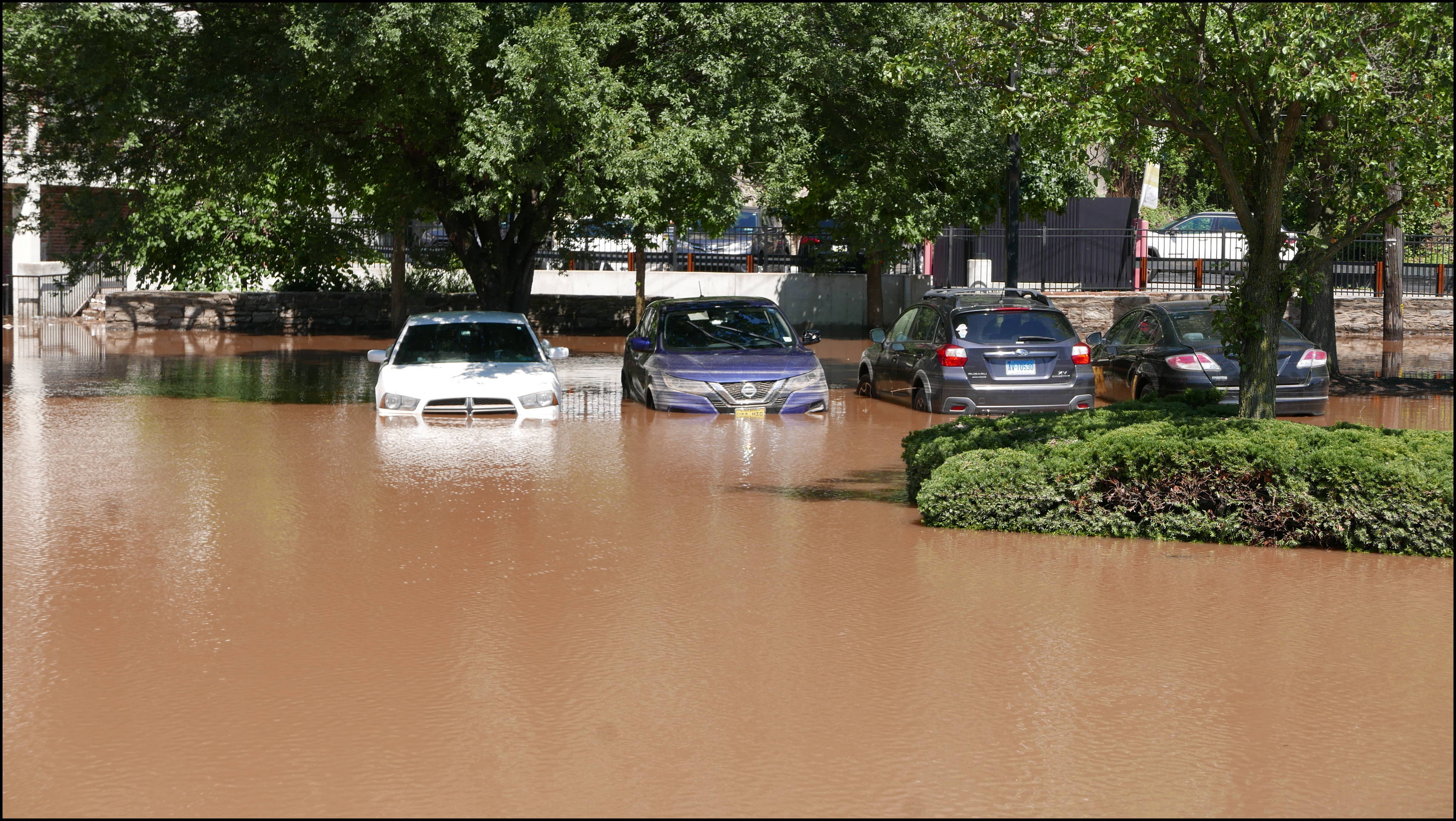 Southern limit of flooding on Main Street -- Flooded cars in the theater parking lot.