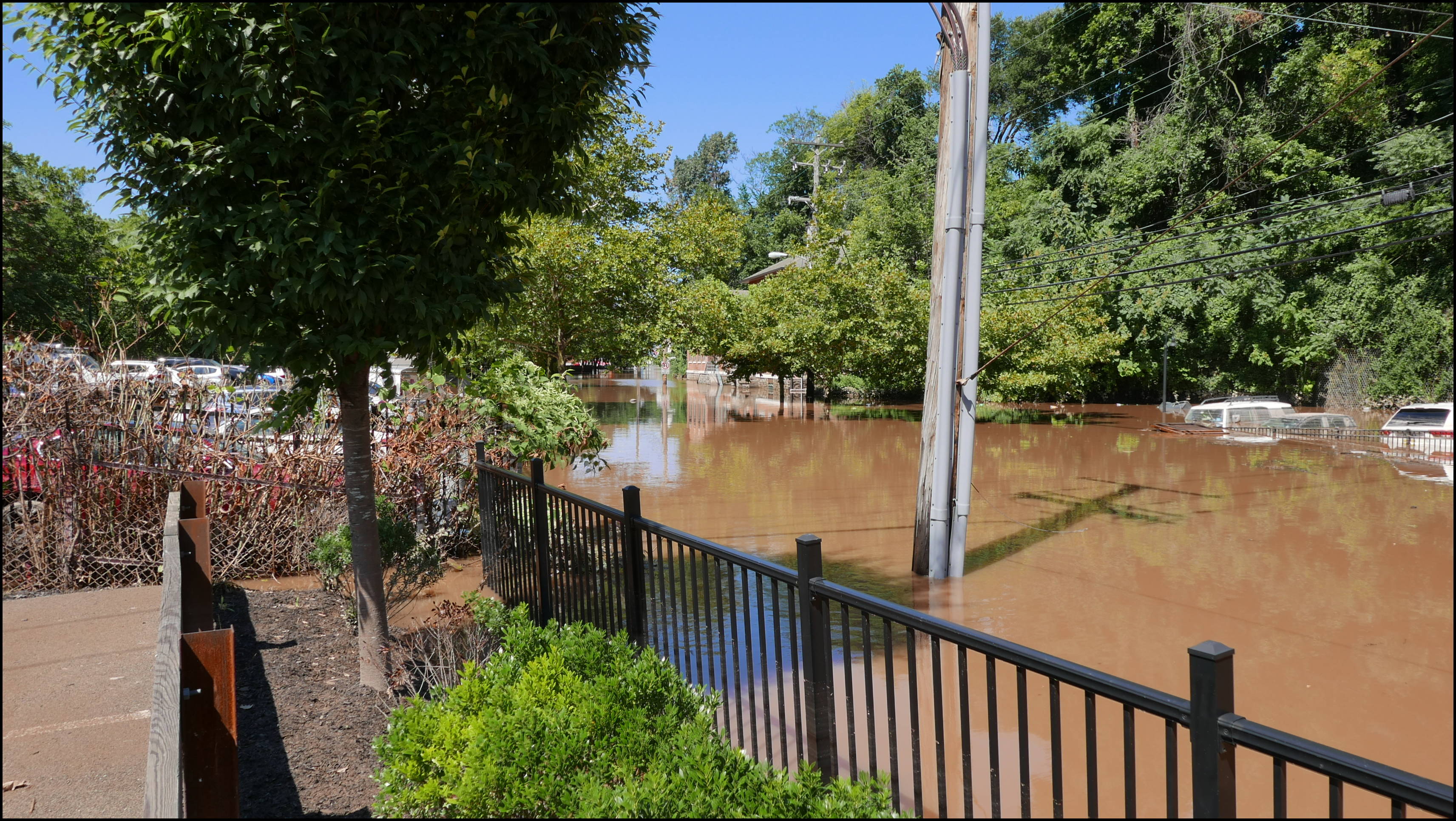 Southern limit of flooding on Main Street -- Flooded cars in the Yarn Factory Lofts (Wilde Yarn) parking lot.