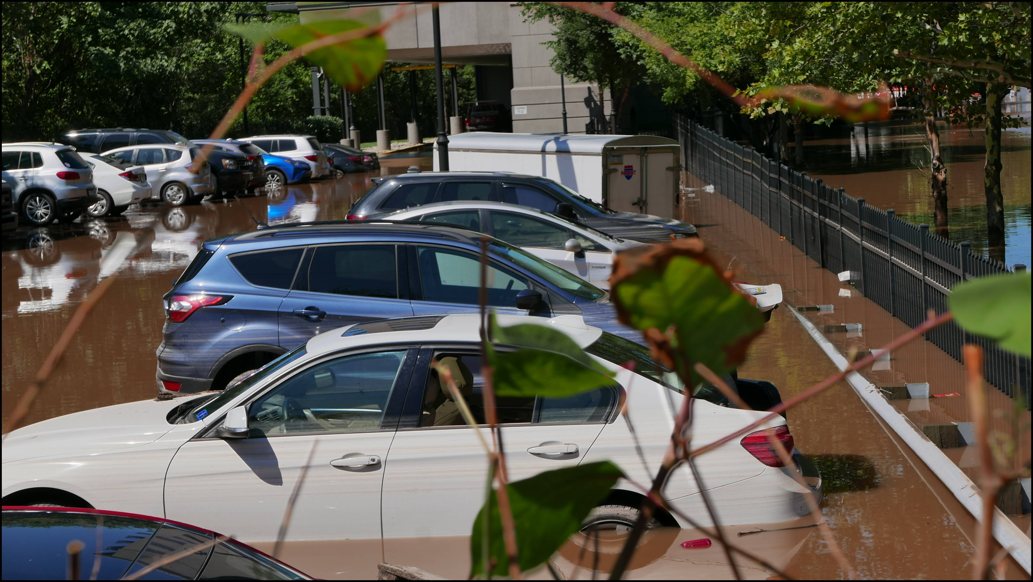 Southern limit of flooding on Main Street -- Flooded cars in the Bridge Five parking lot.