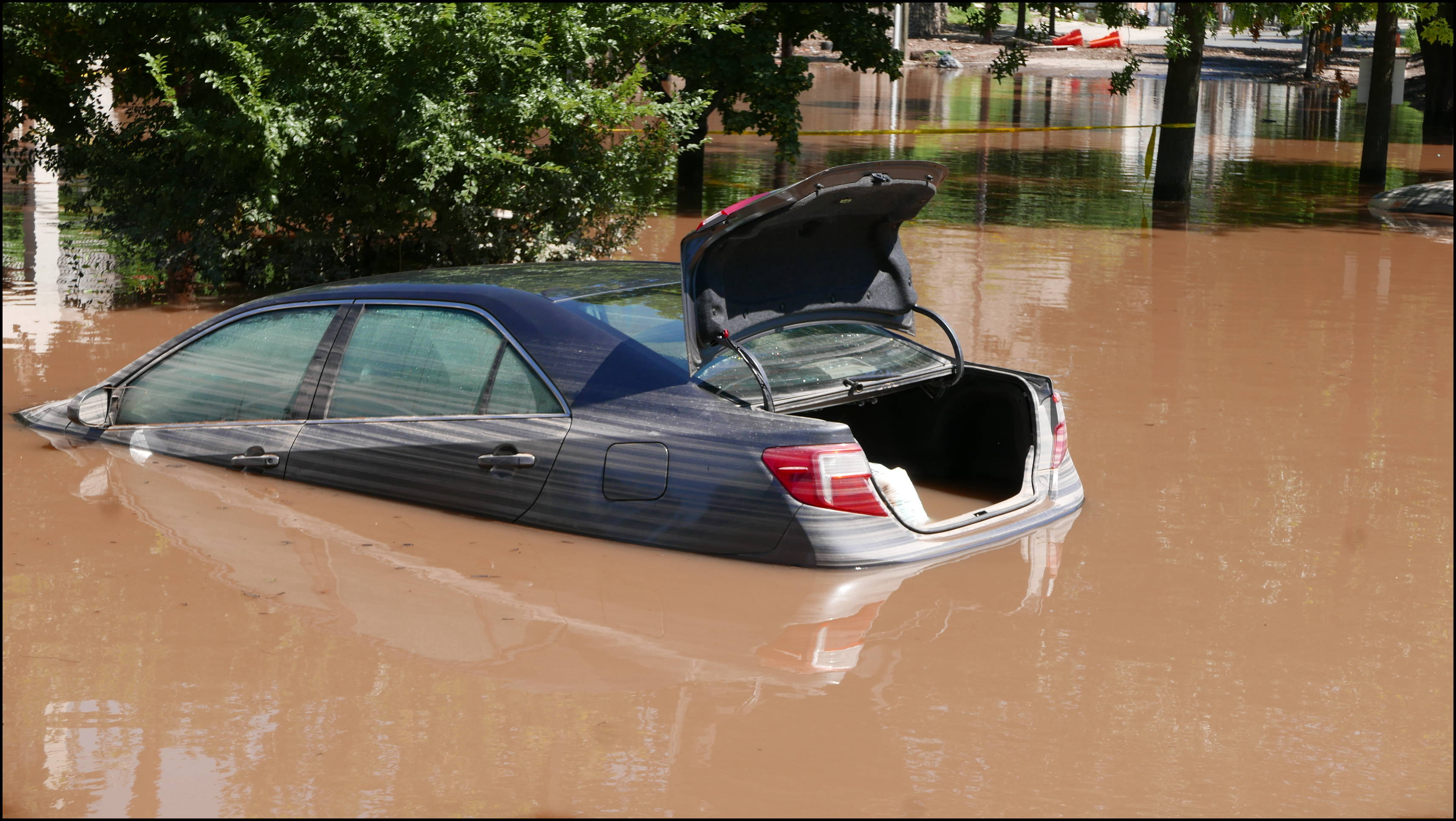 Southern limit of flooding on Main Street -- Flooded cars in the theater parking lot