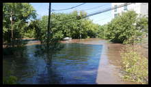 Leverington and Flat Rock Road -- There is a parking lot behind the building top sticking up. Hope they got all the cars out.