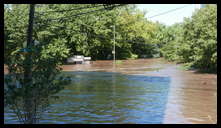 Leverington and Flat Rock Road -- There is a parking lot behind the building top sticking up. Hope they got all the cars out.