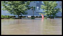 Cotton Street and the canal -- The Isle. A little bit of daylight under the building.