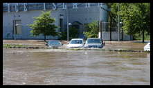 Cotton Street and the canal -- Flooded cars in the Rec Center parking lot