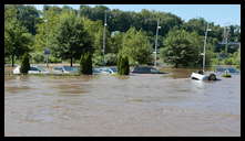 Cotton Street and the canal -- Flooded cars in the Rec Center parking lot