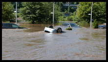 Cotton Street and the canal -- Flooded cars in the Rec Center parking lot