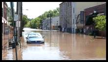 Jamestown looking towards Shurs -- Water rushing onto Main at Shurs