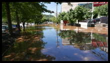 Southern limit of flooding on Main Street -- Flooded cars in the theater parking lot.