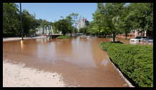 Southern limit of flooding on Main Street -- Flooded cars in the theater parking lot.