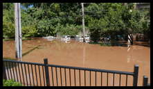 Southern limit of flooding on Main Street -- Flooded cars in the Yarn Factory Lofts (Wilde Yarn) parking lot.